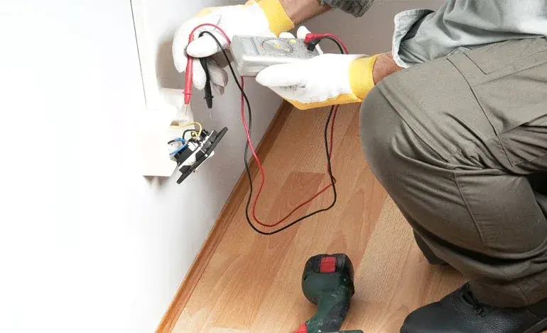 Roland Black electrician testing a home outlet for electrical faults in Gastonia, NC Roland Black electrician testing a home outlet for electrical faults in Gastonia, NC